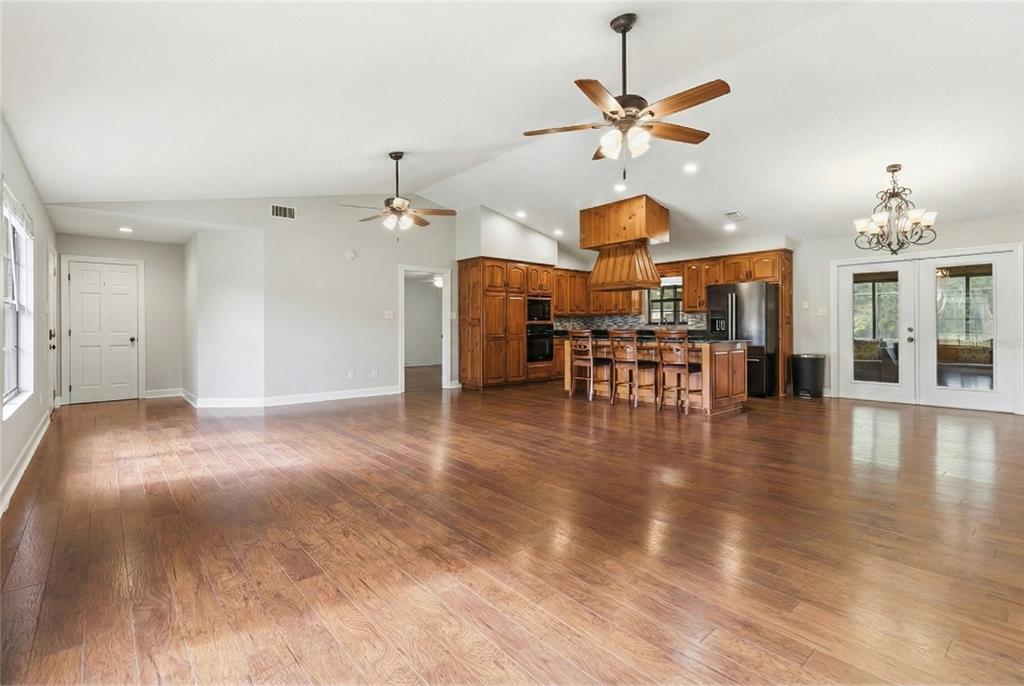 2331 D R Bryant Road Lakeland, FL 33810 - Photo 17 of 74 a view of a livingroom with furniture and chandelier fan