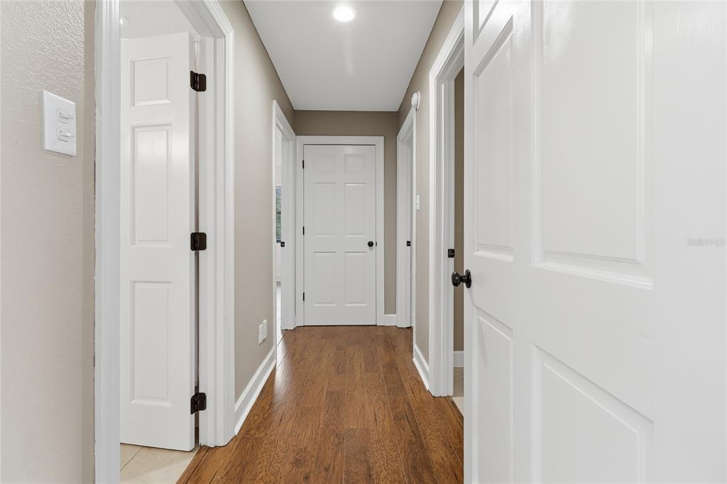 2331 D R Bryant Road Lakeland, FL 33810 - Photo 40 of 74 a view of a hallway with wooden floor and staircase