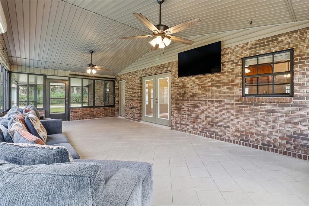 2331 D R Bryant Road Lakeland, FL 33810 - Photo 57 of 74 a living room with furniture and a flat screen tv