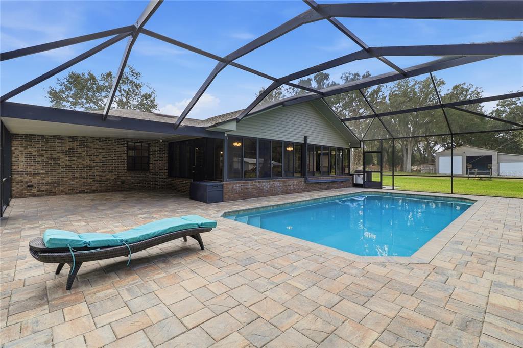 2331 D R Bryant Road Lakeland, FL 33810 - Photo 60 of 74 a view of a swimming pool with a patio