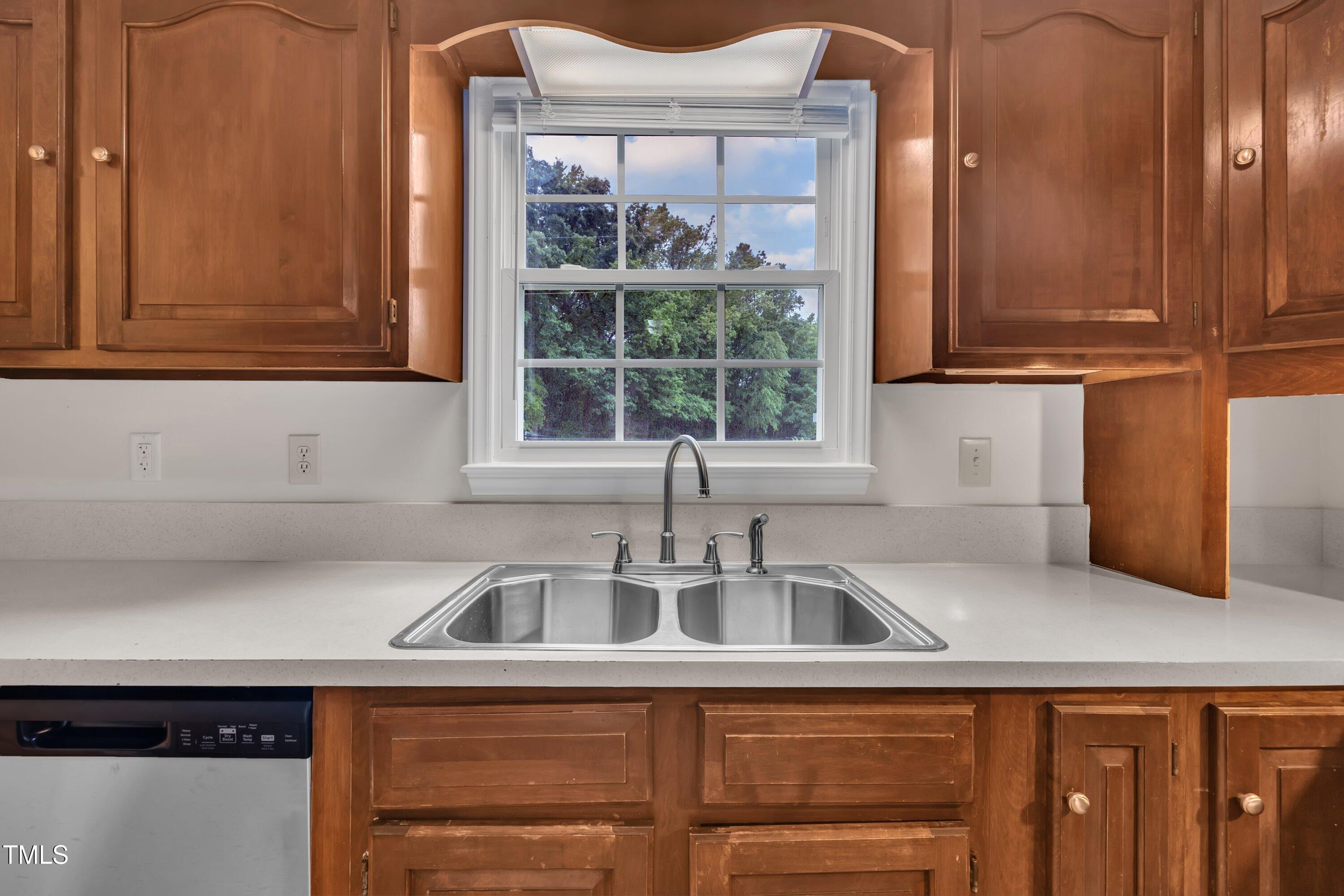 397 Meadow Road Kenly, NC 27542 - Photo 19 of 53 a kitchen with a sink and a window