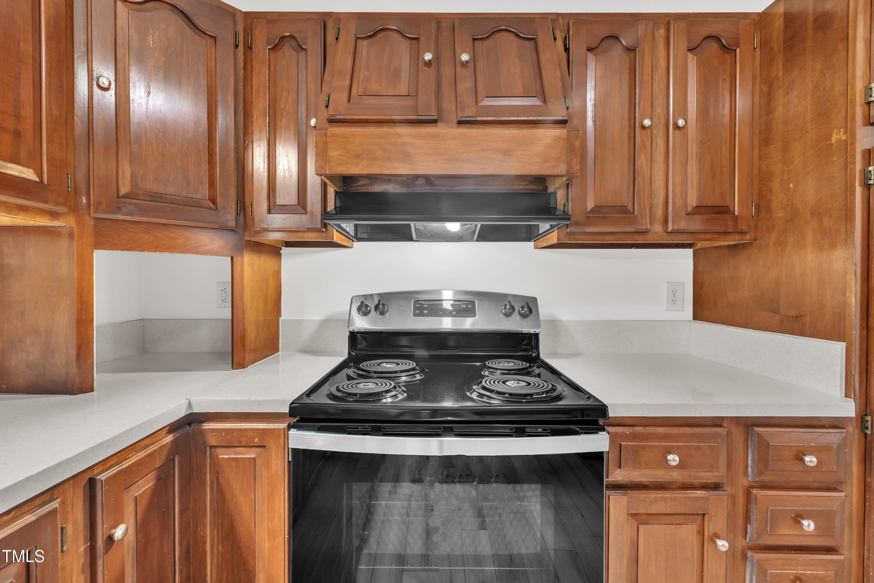 397 Meadow Road Kenly, NC 27542 - Photo 21 of 53 a stove top oven sitting inside of a kitchen