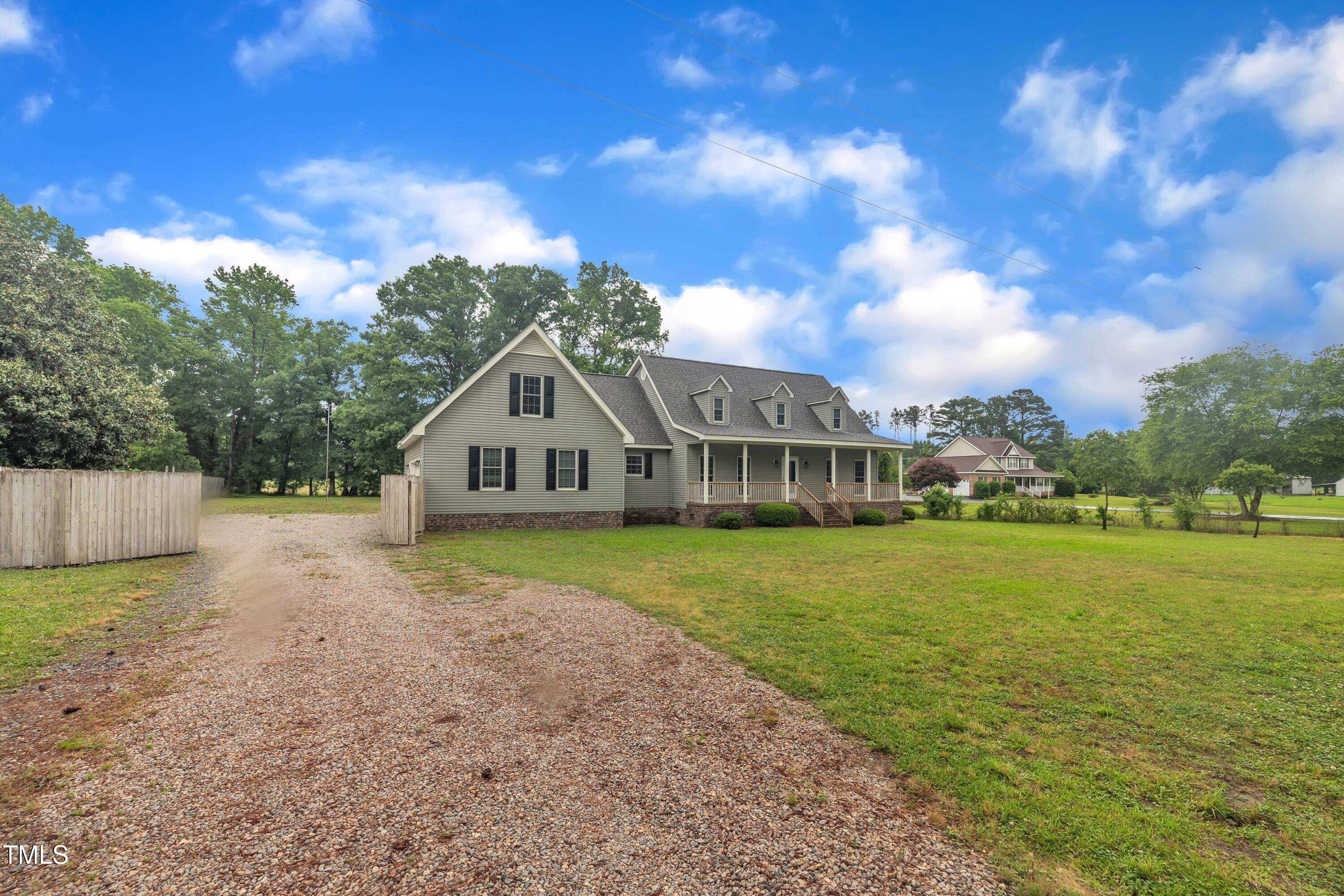 397 Meadow Road Kenly, NC 27542 - Photo 2 of 53 a house view with a garden space