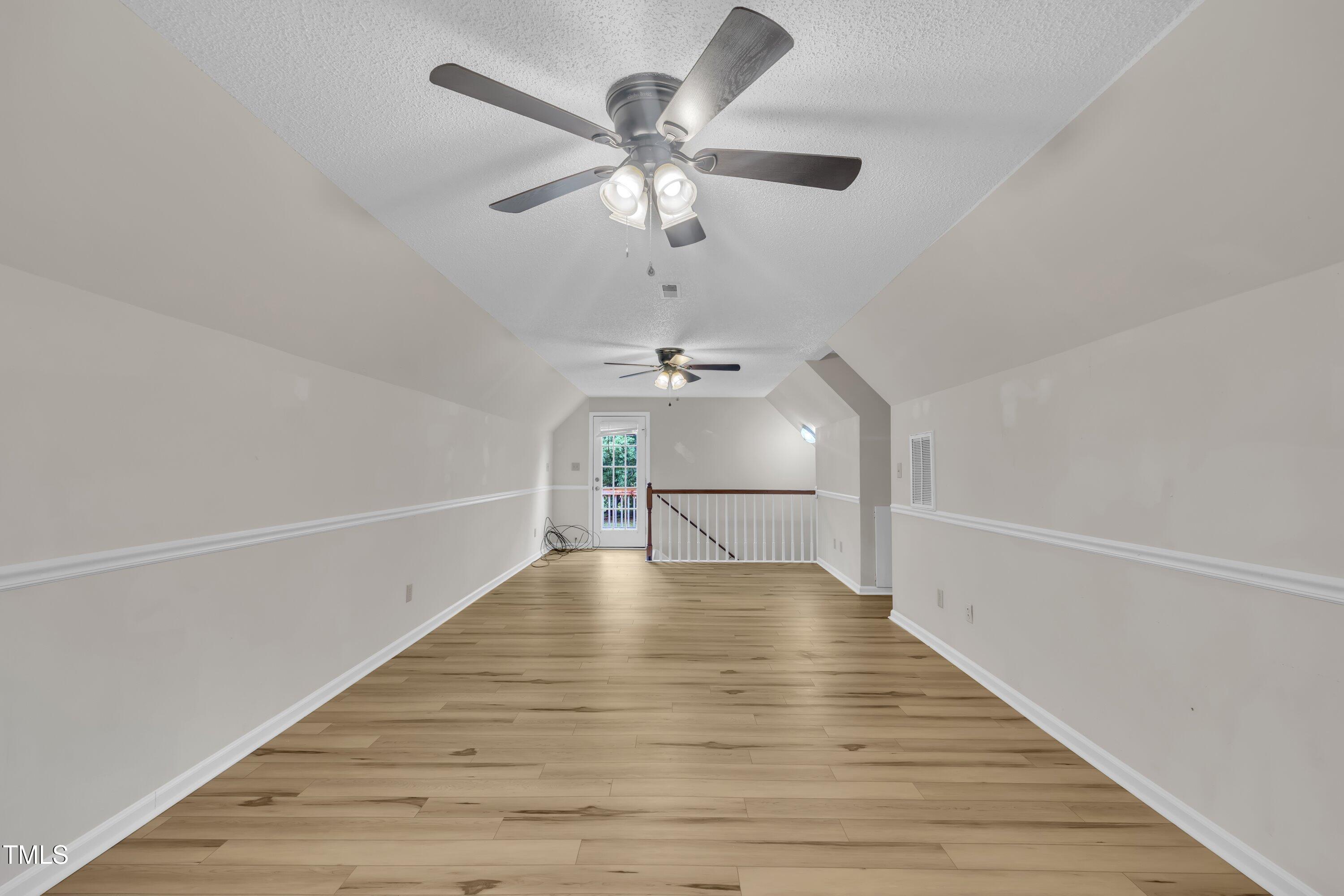 397 Meadow Road Kenly, NC 27542 - Photo 34 of 53 a view of an empty room with wooden floor