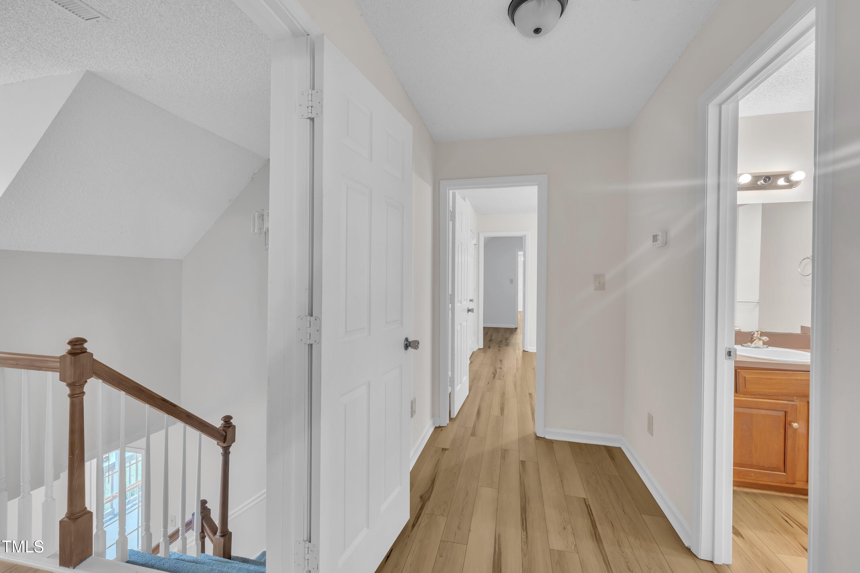 397 Meadow Road Kenly, NC 27542 - Photo 42 of 53 a view of a hallway with wooden floor and staircase