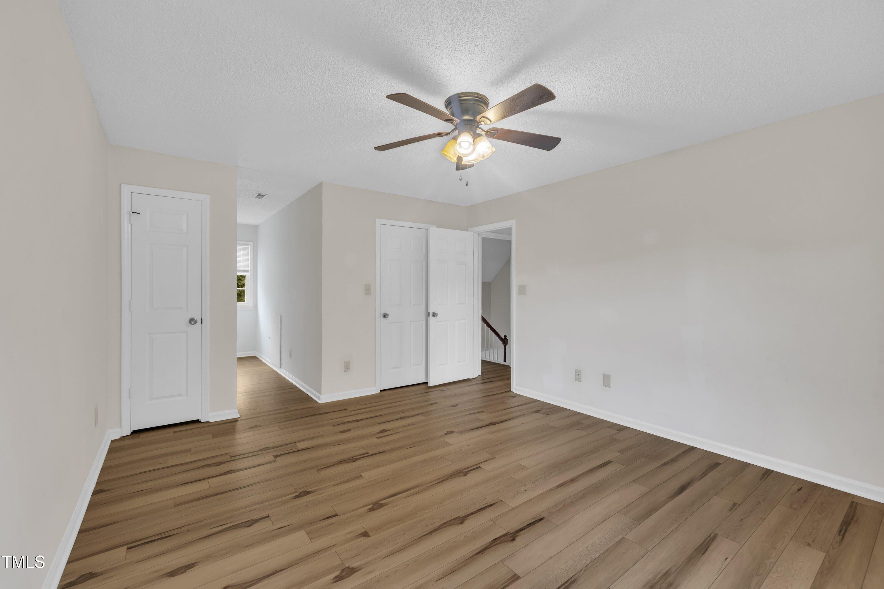 397 Meadow Road Kenly, NC 27542 - Photo 44 of 53 a view of an empty room with wooden floor