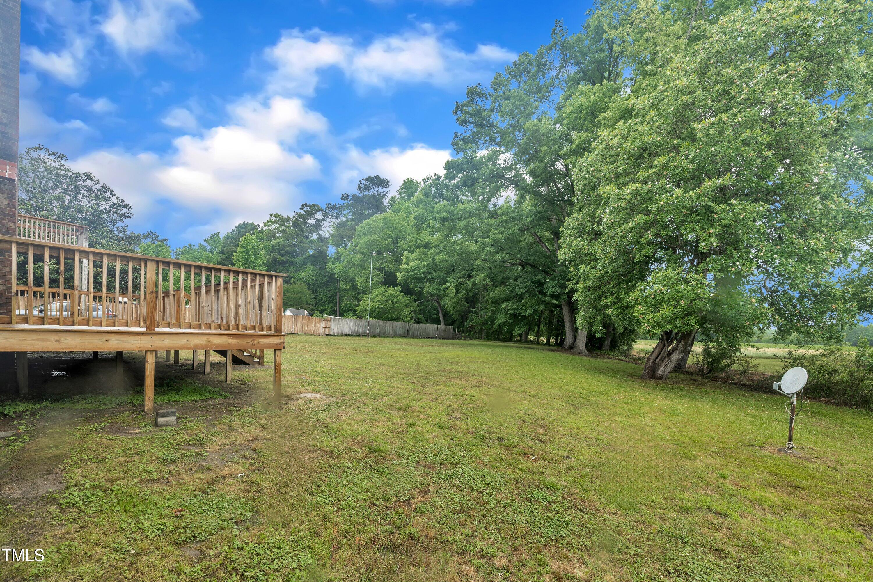 397 Meadow Road Kenly, NC 27542 - Photo 45 of 53 a view of a swimming pool with a yard