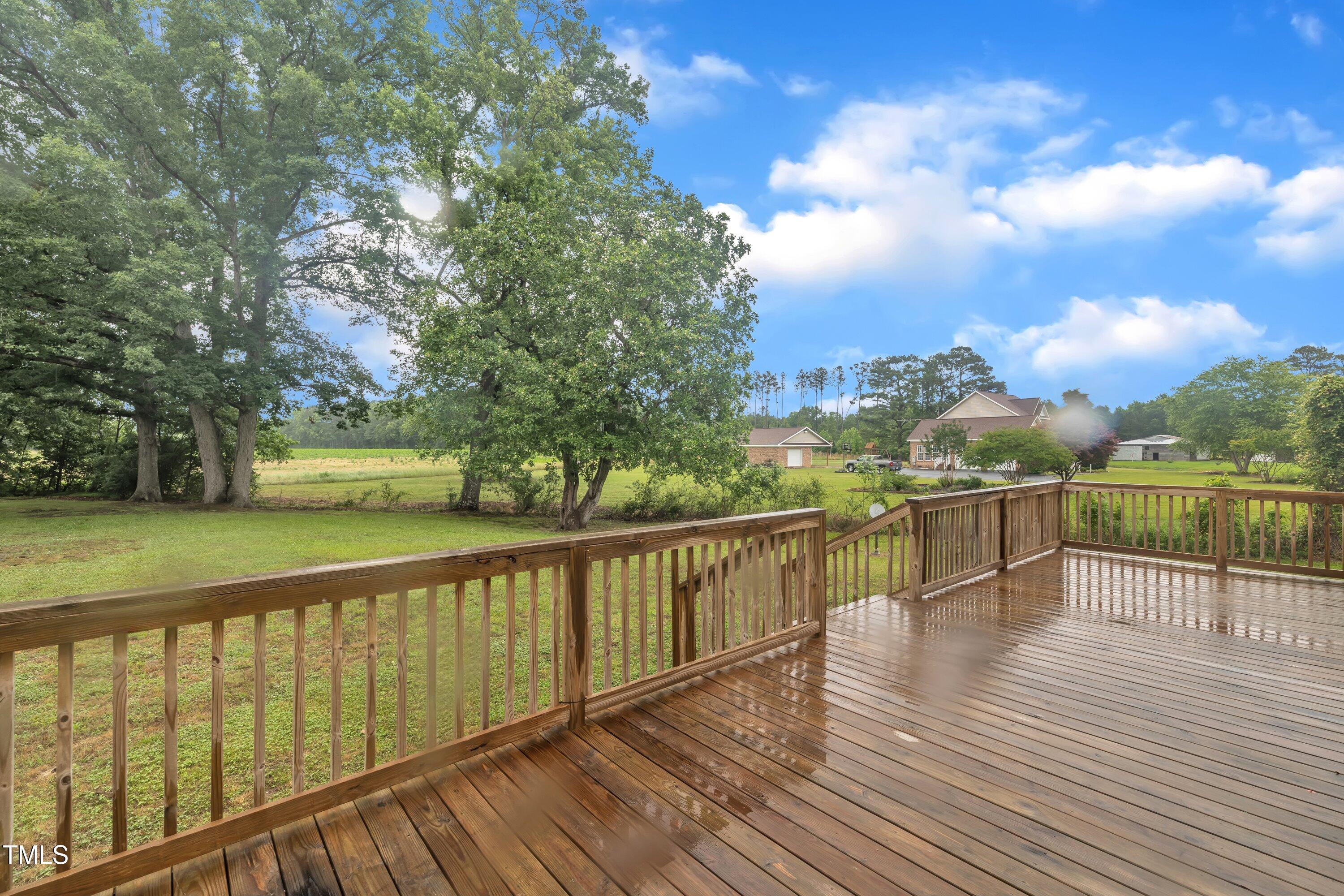 397 Meadow Road Kenly, NC 27542 - Photo 47 of 53 a view of balcony with wooden floor and fence