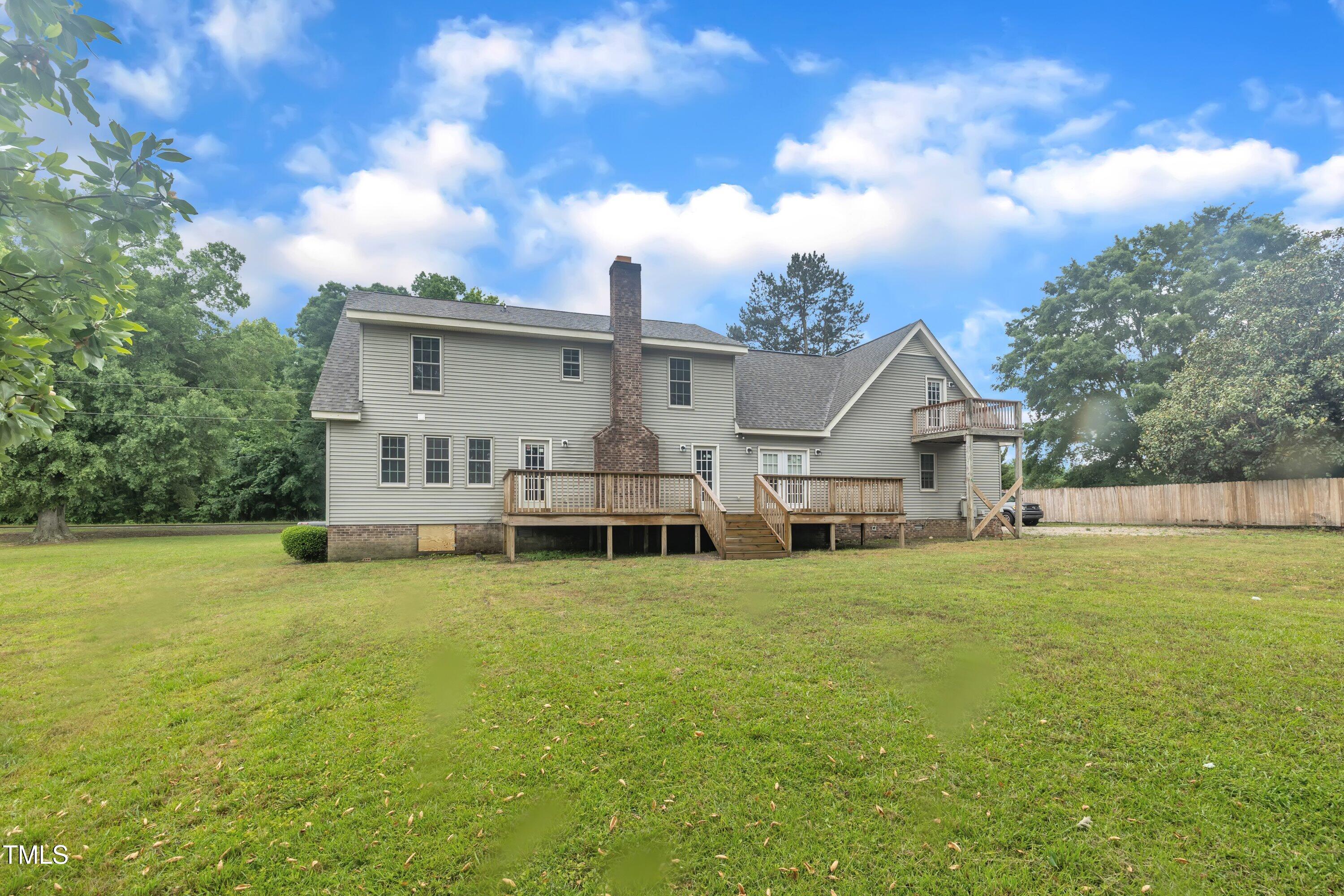 397 Meadow Road Kenly, NC 27542 - Photo 48 of 53 a view of a house with yard in front of it