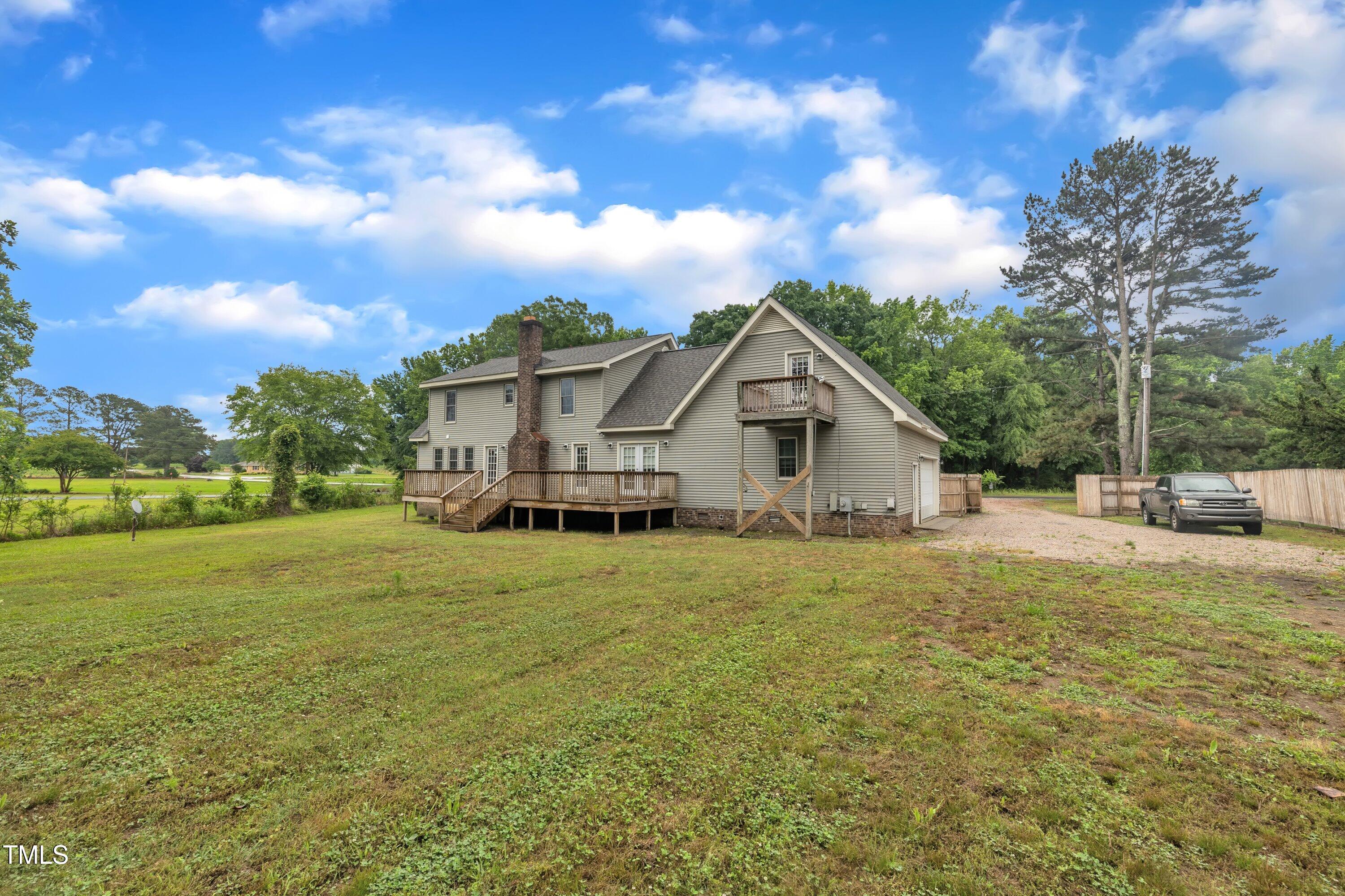 397 Meadow Road Kenly, NC 27542 - Photo 50 of 53 a view of a house with a yard