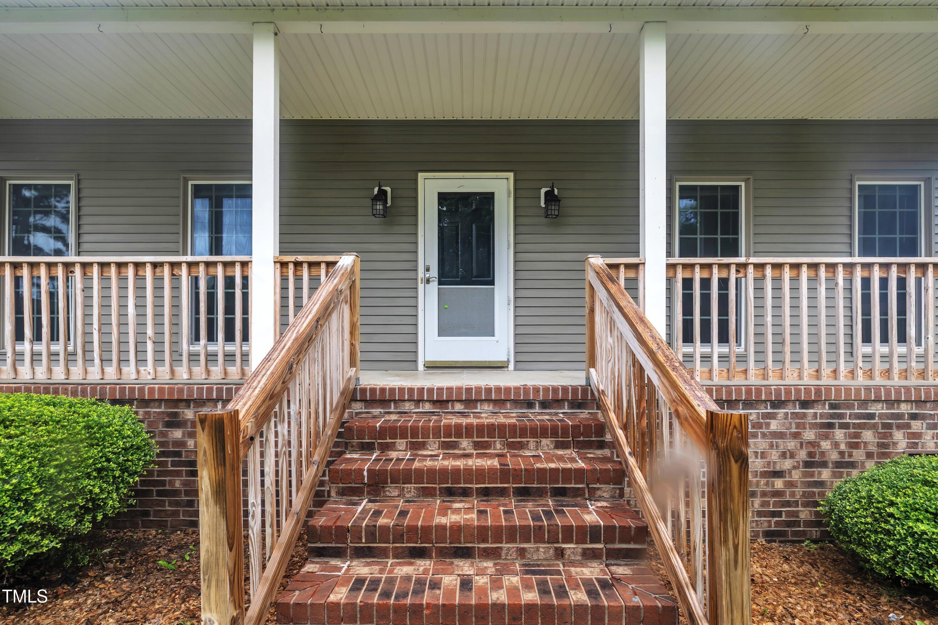 397 Meadow Road Kenly, NC 27542 - Photo 5 of 53 a view of a balcony with door