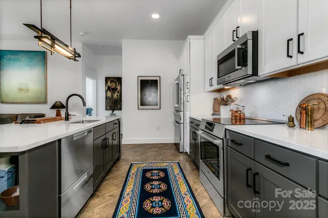 a view of a living room and kitchen