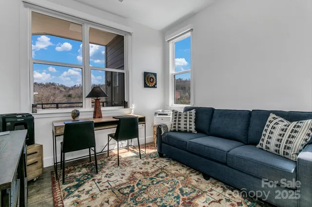 a view of a workspace with furniture