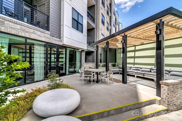 a view of a building with sitting area