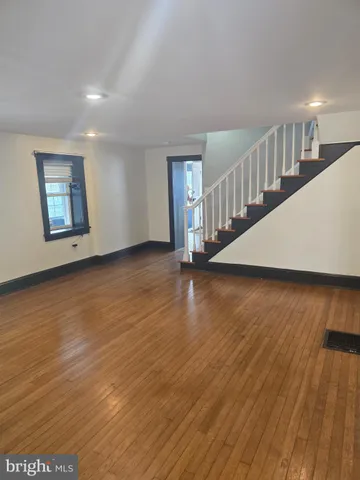 a view of an entryway with wooden floor