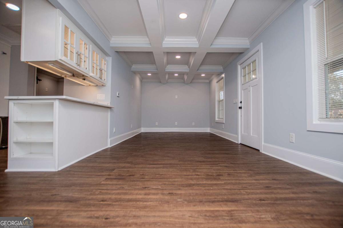 106 Mara Street Carrollton, GA 30117 - Photo 13 of 52 a view of an empty room with wooden floor and a window
