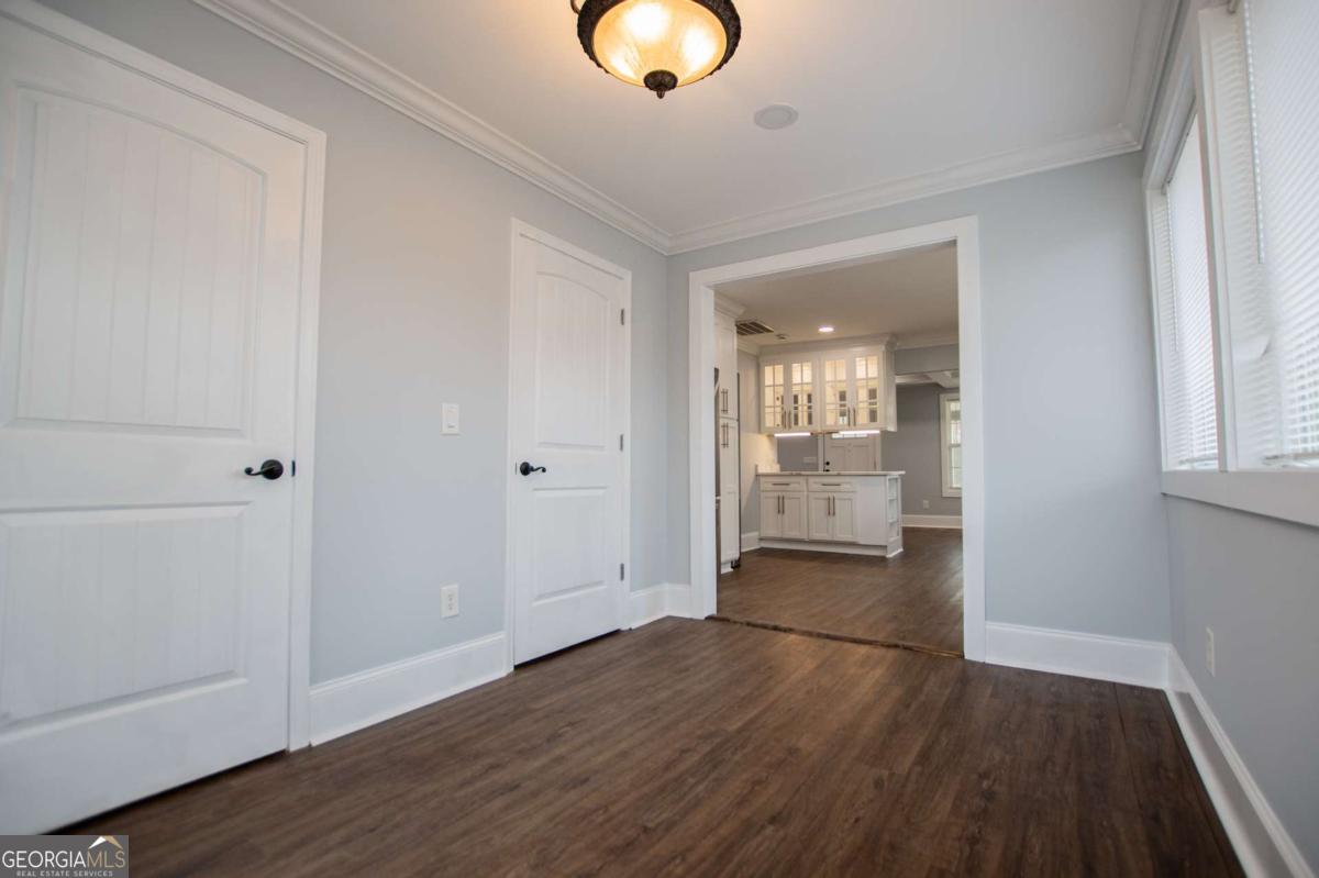 106 Mara Street Carrollton, GA 30117 - Photo 27 of 52 wooden floor in an empty room with a window