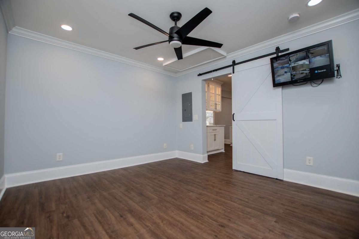 106 Mara Street Carrollton, GA 30117 - Photo 32 of 52 wooden floor in an empty room with a window