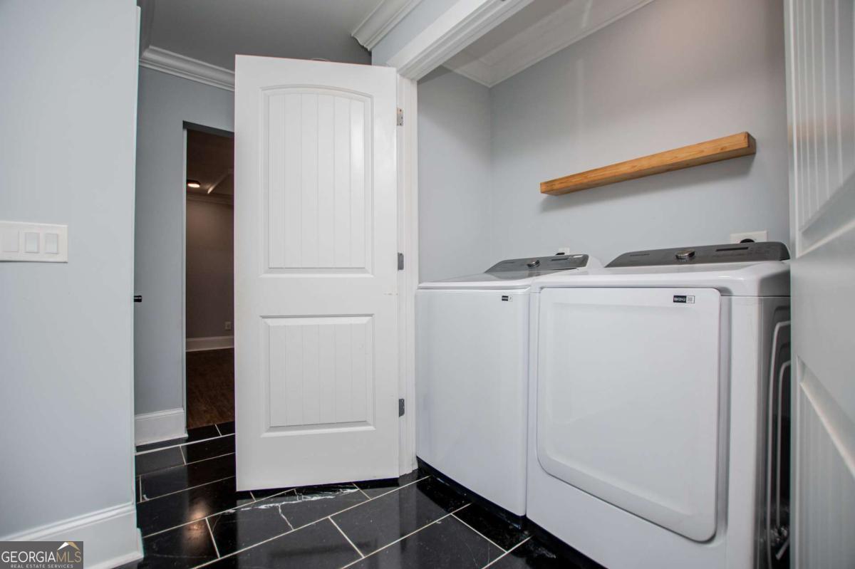 106 Mara Street Carrollton, GA 30117 - Photo 39 of 52 a utility room with dryer and washer
