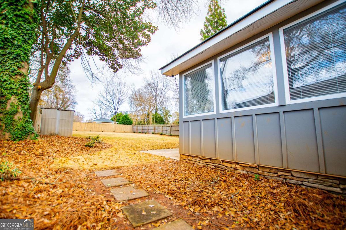 106 Mara Street Carrollton, GA 30117 - Photo 40 of 52 a view of back yard of the house