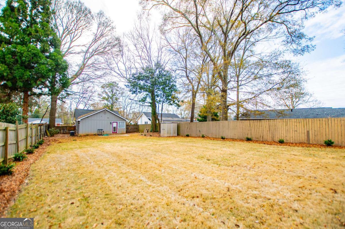 106 Mara Street Carrollton, GA 30117 - Photo 42 of 52 a view of large tree with wooden fence