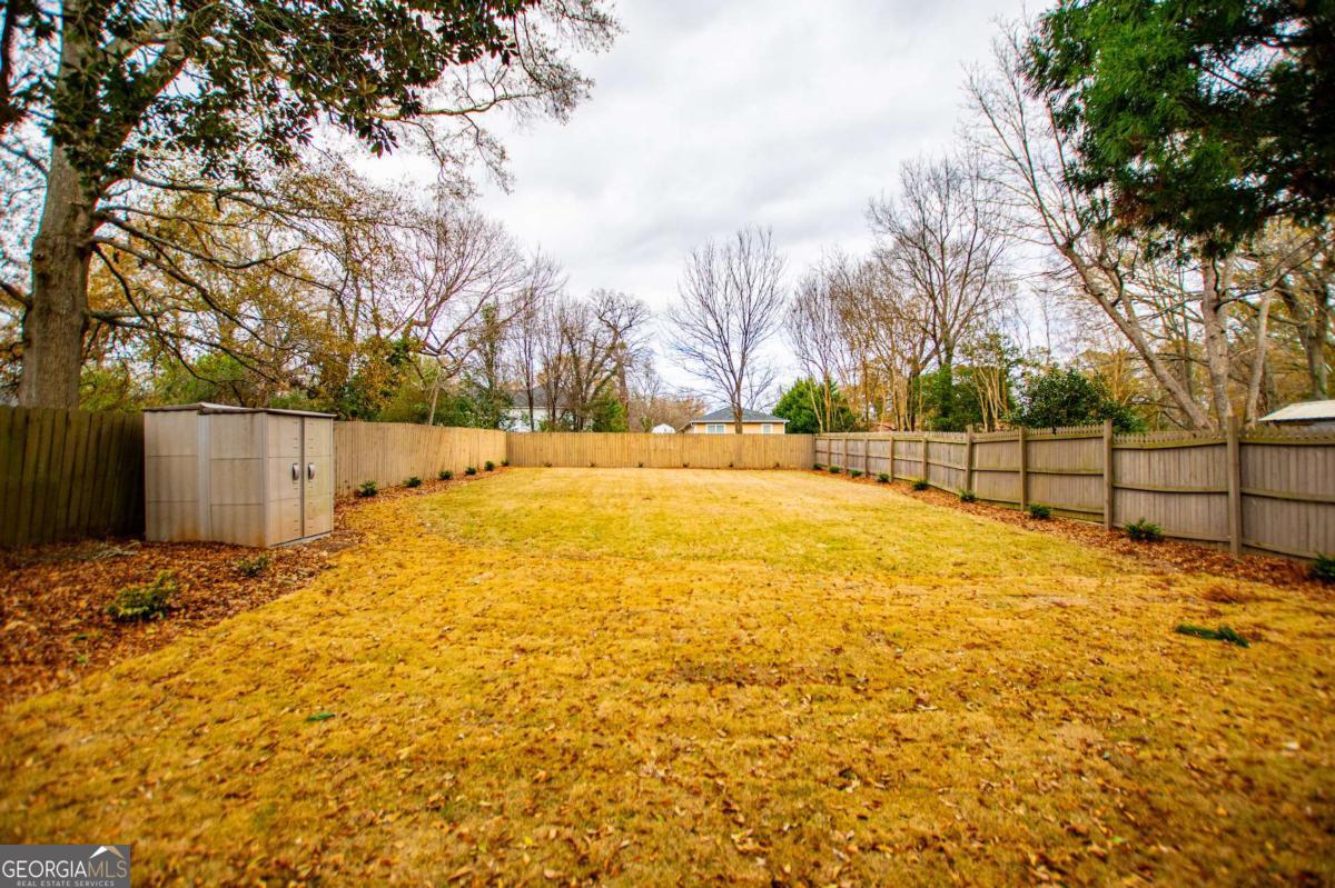106 Mara Street Carrollton, GA 30117 - Photo 43 of 52 a view of yard with large trees