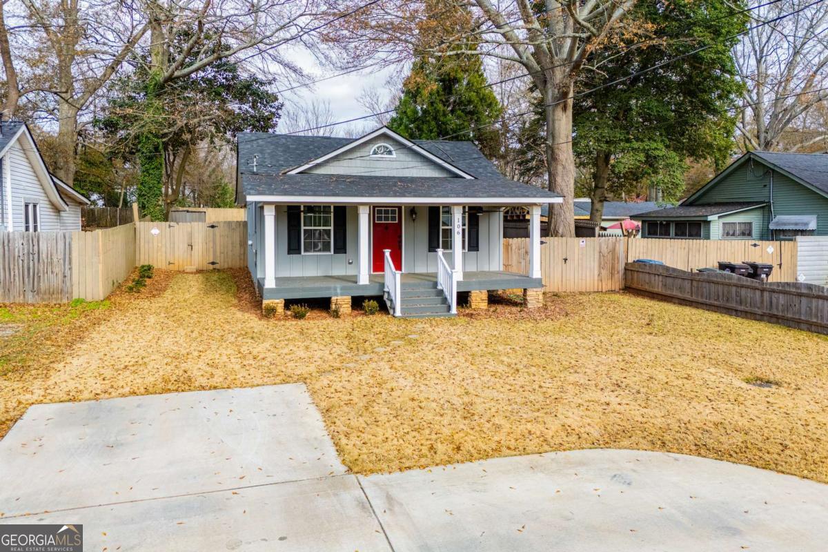 106 Mara Street Carrollton, GA 30117 - Photo 44 of 52 a front view of a house with garden