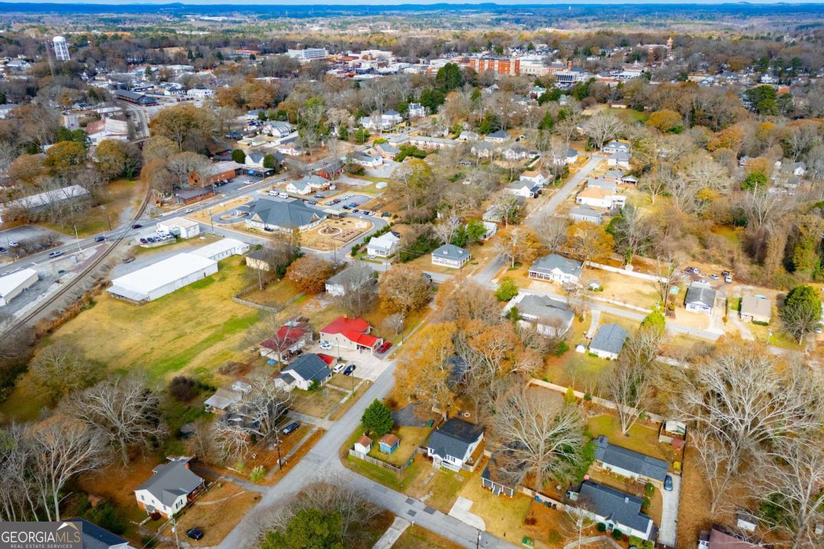 106 Mara Street Carrollton, GA 30117 - Photo 52 of 52 an aerial view of residential houses with outdoor space