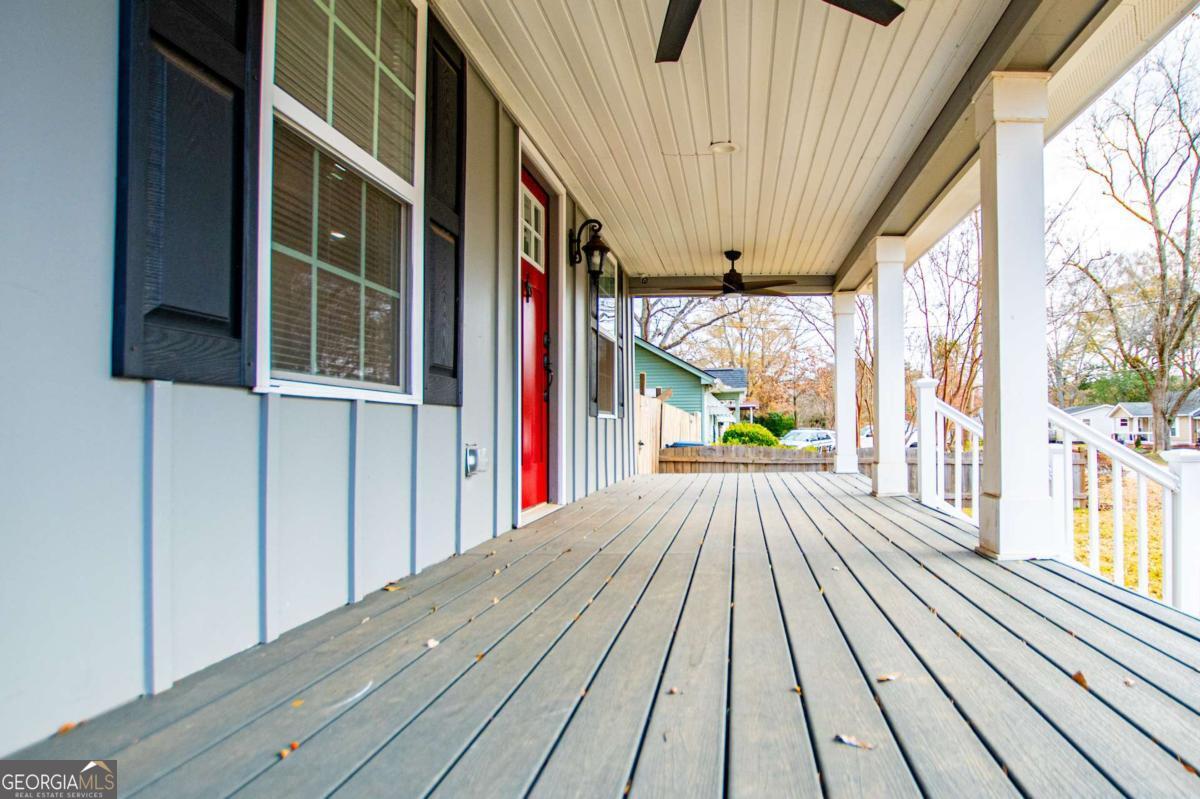 106 Mara Street Carrollton, GA 30117 - Photo 10 of 52 a view of balcony with wooden floor and door