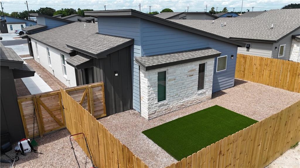 4013 Jenna Lane, Unit D Weslaco, TX 78599 - Photo 13 of 24 a aerial view of a house with roof deck front of house
