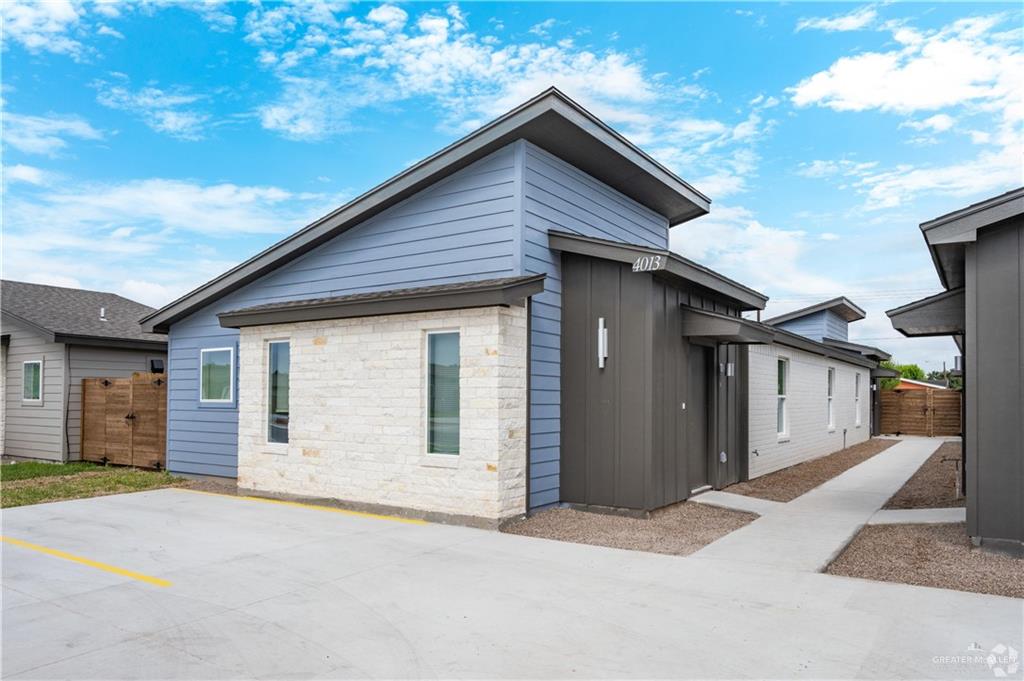 4013 Jenna Lane, Unit D Weslaco, TX 78599 - Photo 2 of 24 a front view of a house with a garage