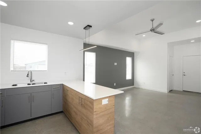 a spacious bathroom with a double vanity sink and a mirror