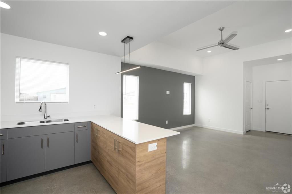 4013 Jenna Lane, Unit D Weslaco, TX 78599 - Photo 5 of 24 a spacious bathroom with a double vanity sink and a mirror