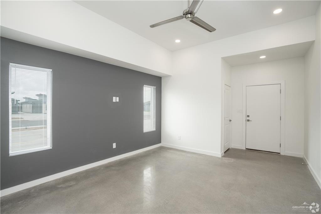 4013 Jenna Lane, Unit D Weslaco, TX 78599 - Photo 6 of 24 an empty room with windows and fan