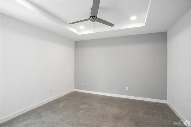an empty room with a fan