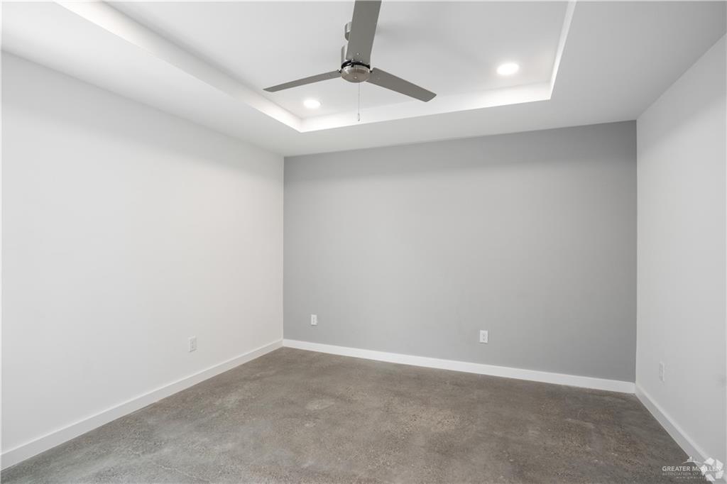 4013 Jenna Lane, Unit D Weslaco, TX 78599 - Photo 9 of 24 an empty room with a fan