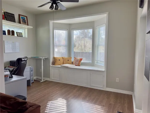 a workspace with furniture and window