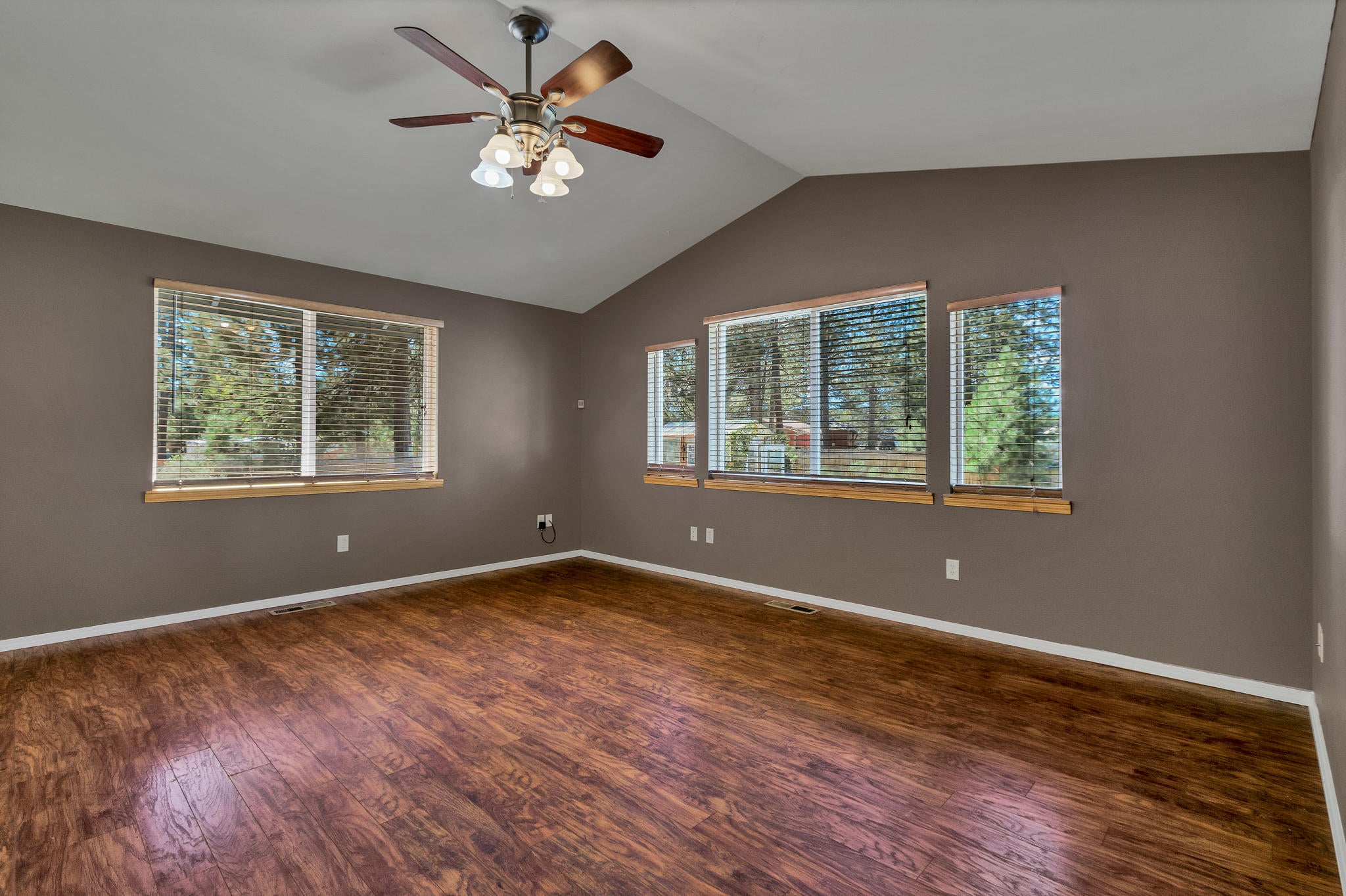 expansive shot of the great room w/vaulted ceilings