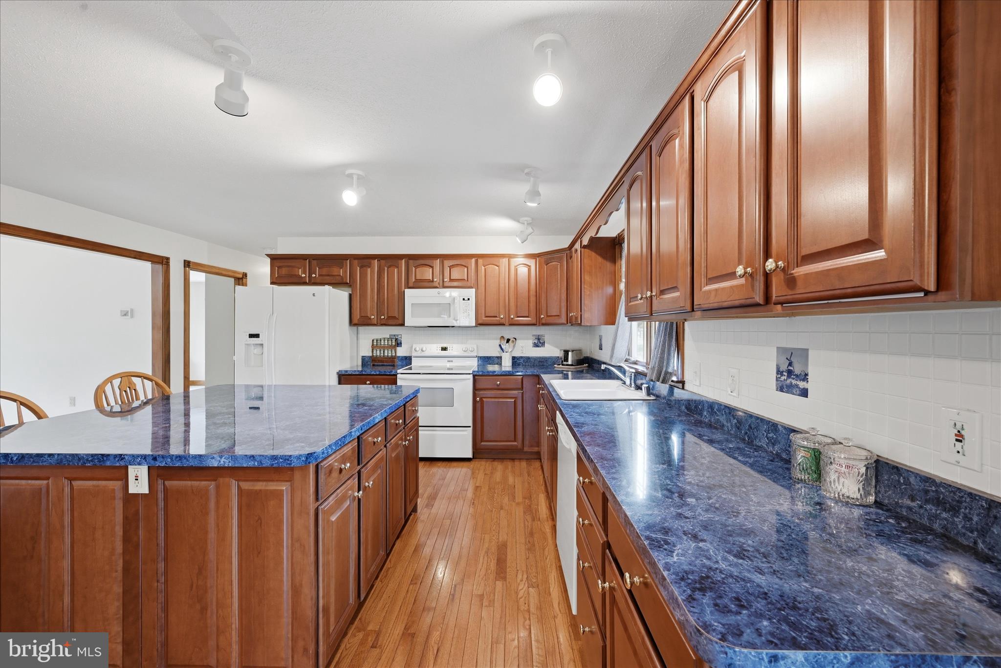 412 Ruebuck Road Clear Brook, VA 22624 - Photo 12 of 43 a kitchen with stainless steel appliances granite countertop a sink stove and refrigerator