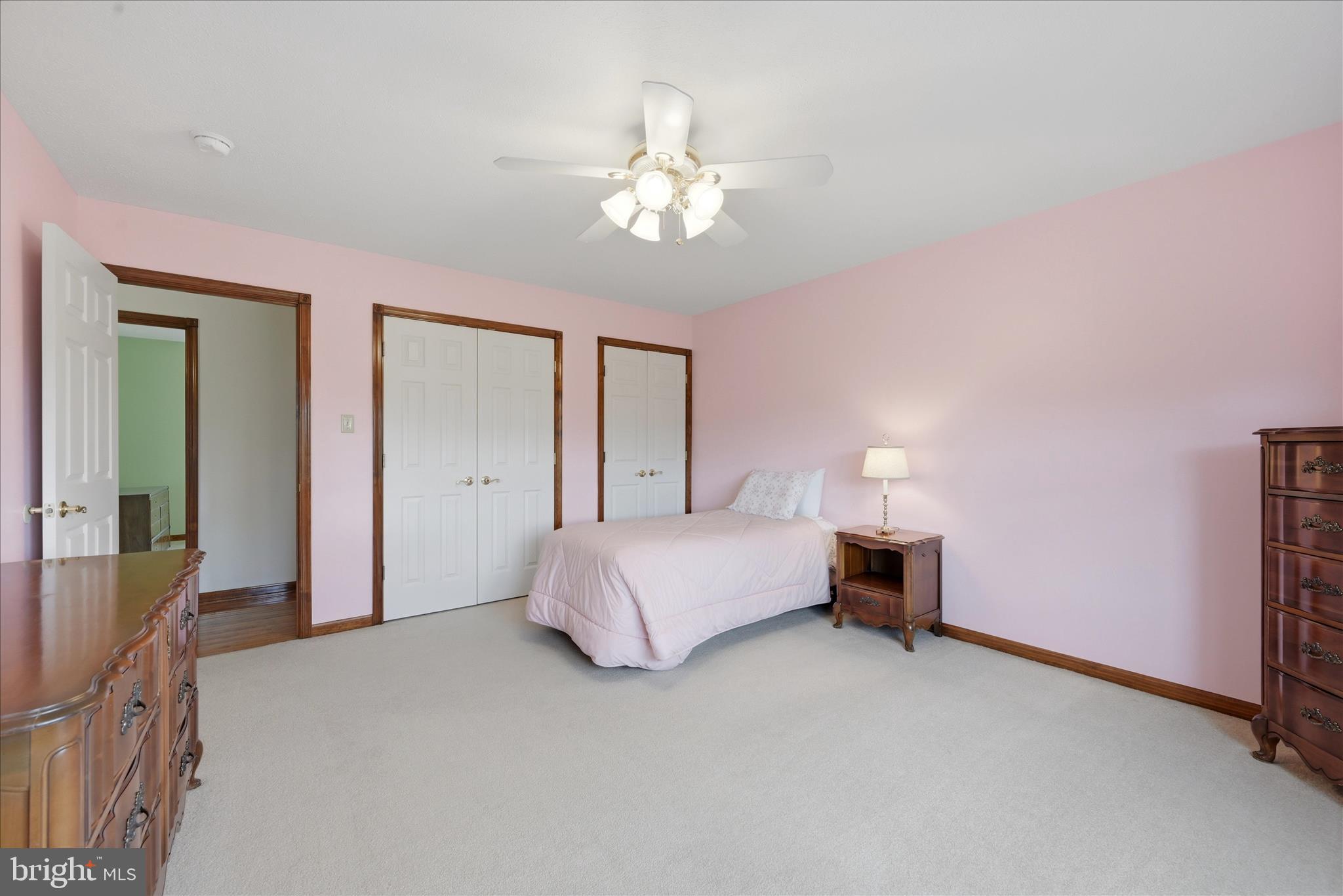 412 Ruebuck Road Clear Brook, VA 22624 - Photo 19 of 43 a bedroom with a bed and a chandelier