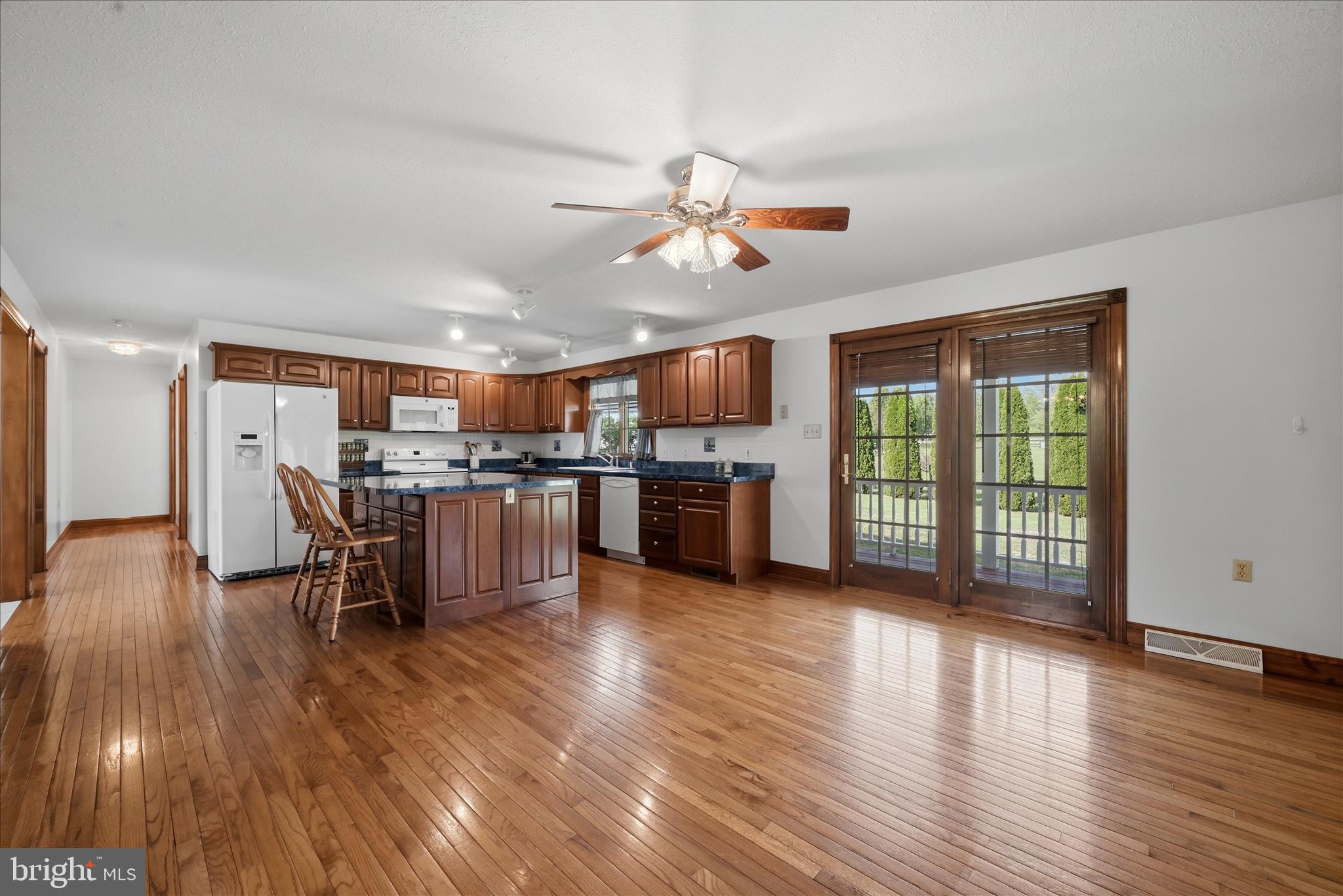 412 Ruebuck Road Clear Brook, VA 22624 - Photo 7 of 43 a view of a kitchen with furniture and wooden floor