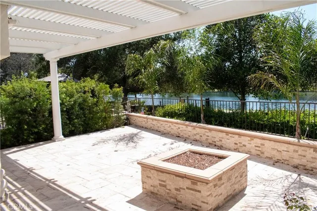 a view of backyard with patio