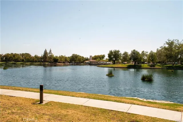 a view of a lake with houses in the back