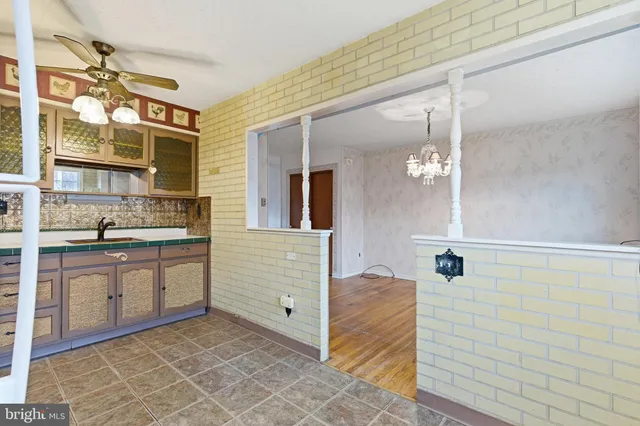 a bathroom with a sink a vanity and shower