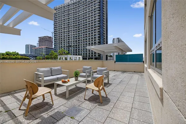 a view of a terrace with sitting area