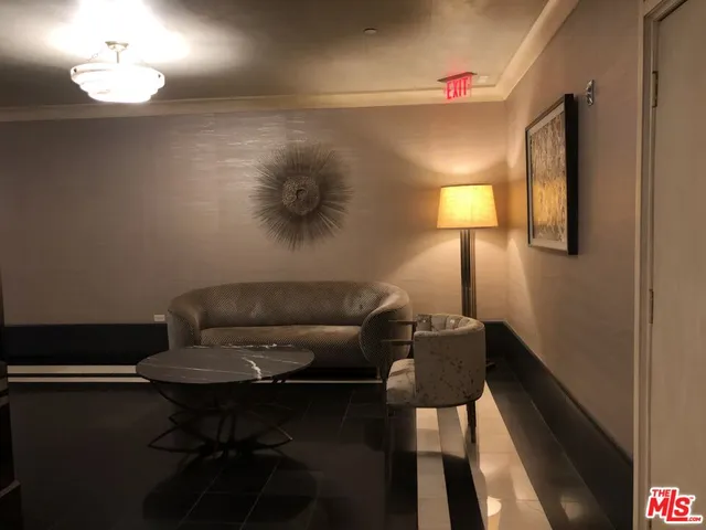 a kitchen view with a sink a table and chairs