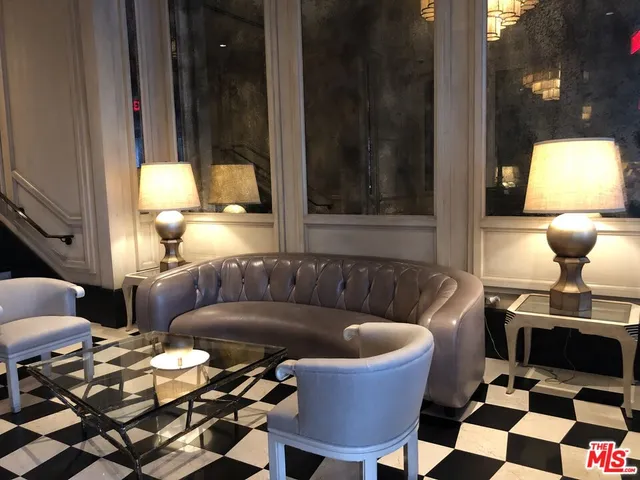 a kitchen with a refrigerator and a stove top oven