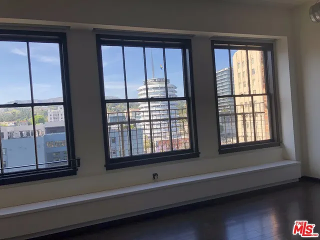 a bathroom with a sink and a large window