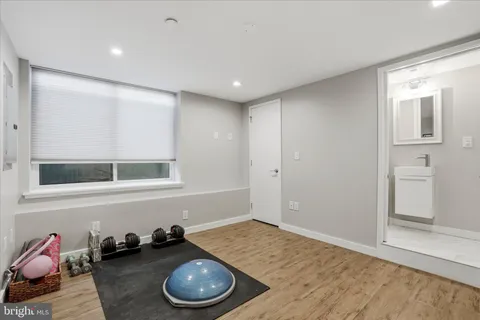 a bathroom with a sink a mirror and shower