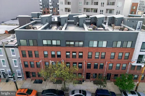 an aerial view of a house with outdoor space
